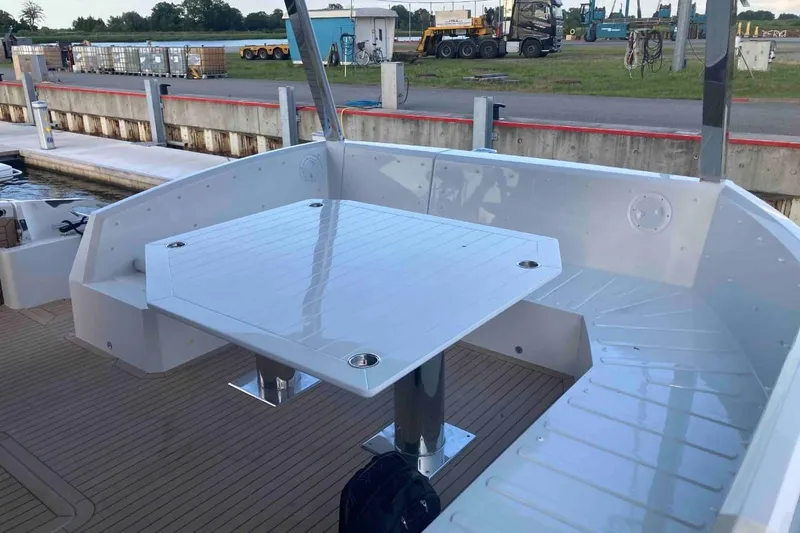  Yacht Photos Pics 2023 Galeon 640 Fly yacht deck with sleek white table and seating area.