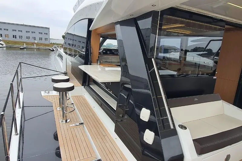  Yacht Photos Pics 2023 Galeon 640 Fly yacht with sleek deck and modern seating area.