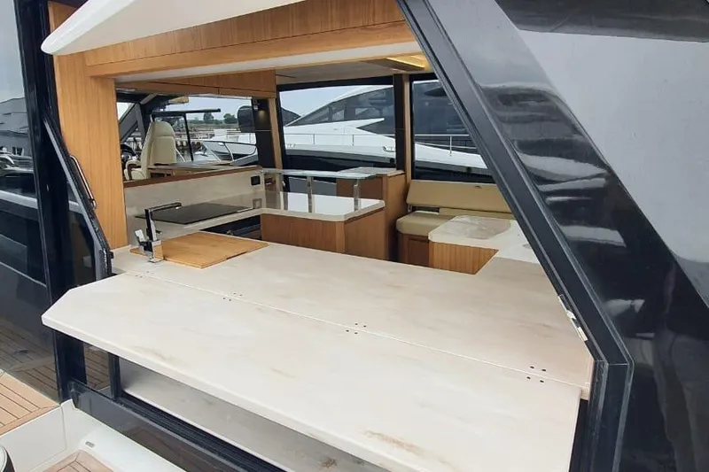 Yacht Photos Pics 2023 Galeon 640 Fly yacht interior with modern kitchen and seating area.