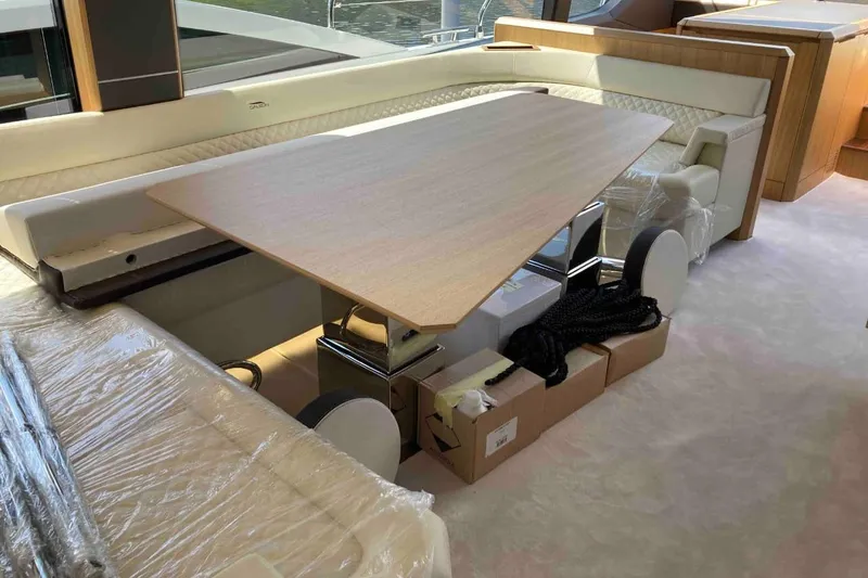  Yacht Photos Pics Luxurious interior of 2023 Galeon 640 Fly yacht with elegant dining area.