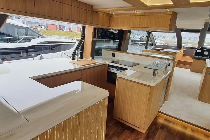  Yacht Photos Pics Luxurious interior of 2023 Galeon 640 Fly yacht with modern kitchen design.