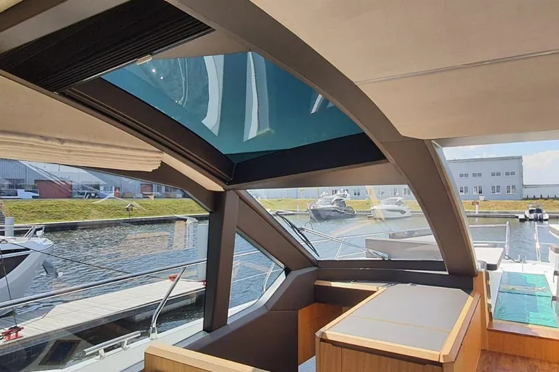  Yacht Photos Pics Interior view of 2023 Galeon 640 Fly yacht with panoramic windows and modern design.