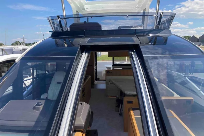  Yacht Photos Pics 2023 Galeon 640 Fly yacht with sleek glass design and luxurious interior.