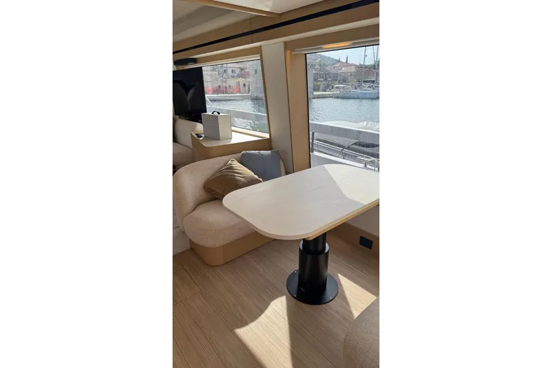  Yacht Photos Pics Luxurious interior of 2025 Azimut Fly 62 yacht with elegant seating and waterfront view.