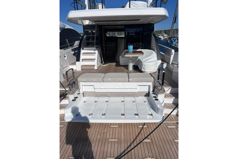  Yacht Photos Pics 2025 Azimut Fly 62 yacht deck with seating and table, showcasing luxury design.