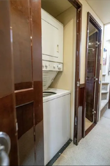  Yacht Photos Pics Laundry area inside 2008 Sea Ray 58 Sedan Bridge yacht with stacked washer and dryer.