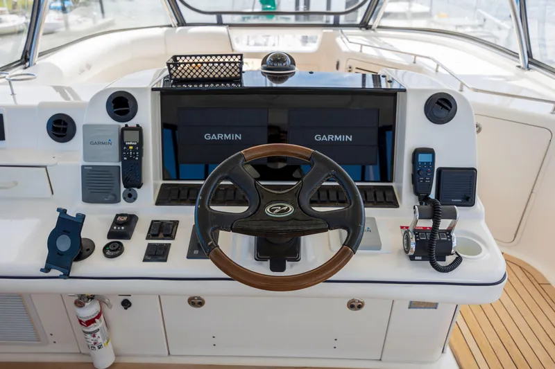  Yacht Photos Pics 2008 Sea Ray 58 Sedan Bridge helm with Garmin navigation and wooden steering wheel.