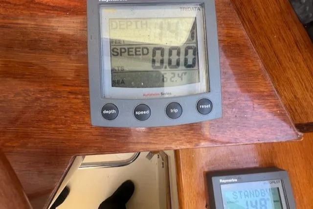 Free Will Yacht Photos Pics Boat dashboard showing speed and depth on a Hinckley 2003 Pilothouse 36.