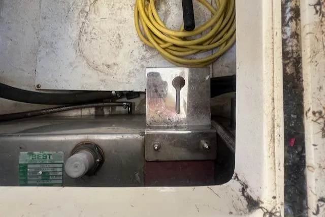 Free Will Yacht Photos Pics Engine compartment of a 2003 Hinckley Extended Hardtop Pilothouse 36 Picnic Boat with yellow cable.