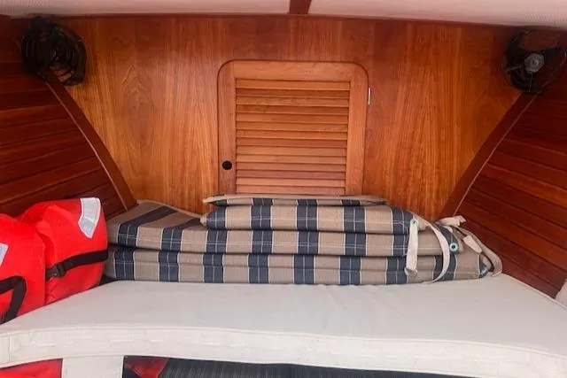 Free Will Yacht Photos Pics Interior of 2003 Hinckley Pilothouse 36 with cushions and life jackets.