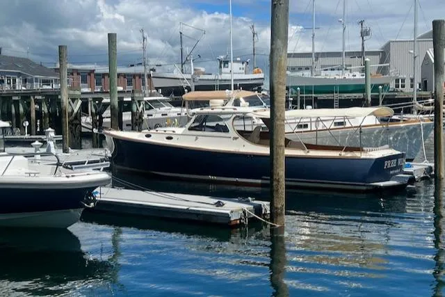 Free Will Yacht Photos Pics 2003 Hinckley Extended Hardtop Pilothouse 36 Picnic Boat docked at a marina.