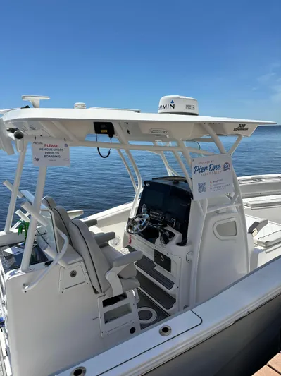 328 Sea Fox Commander Yacht Photos Pics 2020 Sea Fox Commander 328 boat docked on calm water under clear blue sky.