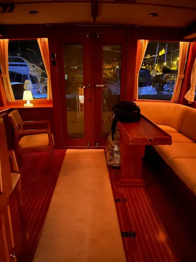  Yacht Photos Pics Luxurious interior of 2004 Grand Banks Eastbay 54 SX yacht with warm lighting and elegant furnishings.