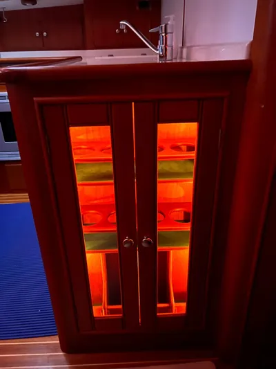  Yacht Photos Pics Illuminated cabinet with glass doors on a 2004 Grand Banks Eastbay 54 SX yacht.