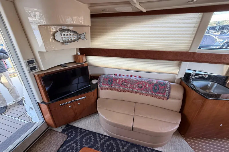  Yacht Photos Pics Interior of 2007 Meridian 341 Sedan yacht with TV, sofa, and kitchenette.