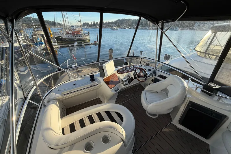  Yacht Photos Pics Interior view of 2007 Meridian 341 Sedan yacht cockpit with marina background.