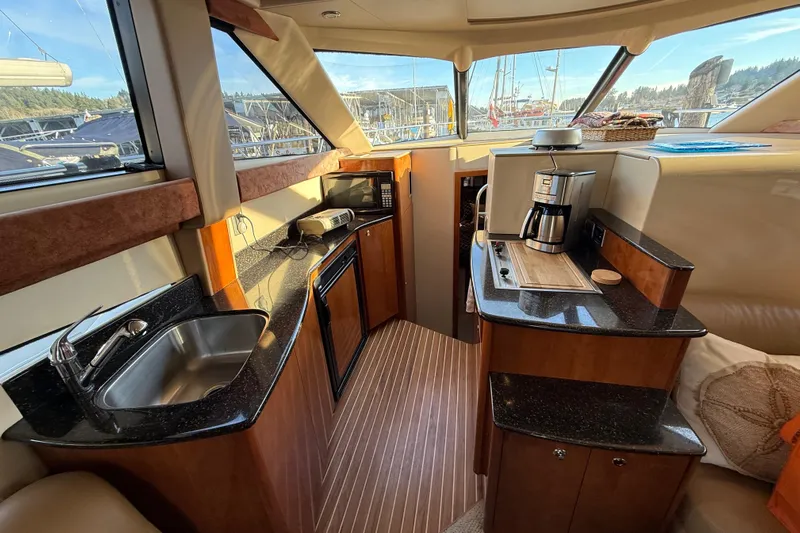  Yacht Photos Pics Luxurious 2007 Meridian 341 Sedan yacht interior with modern kitchen amenities.