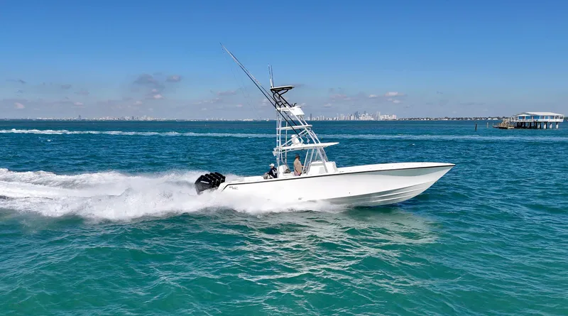  Yacht Photos Pics 2017 SeaVee 390Z boat speeding on clear blue ocean waters.