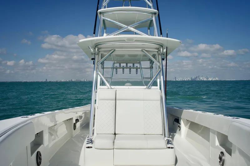  Yacht Photos Pics 2017 SeaVee 390Z boat on open water with city skyline in background.