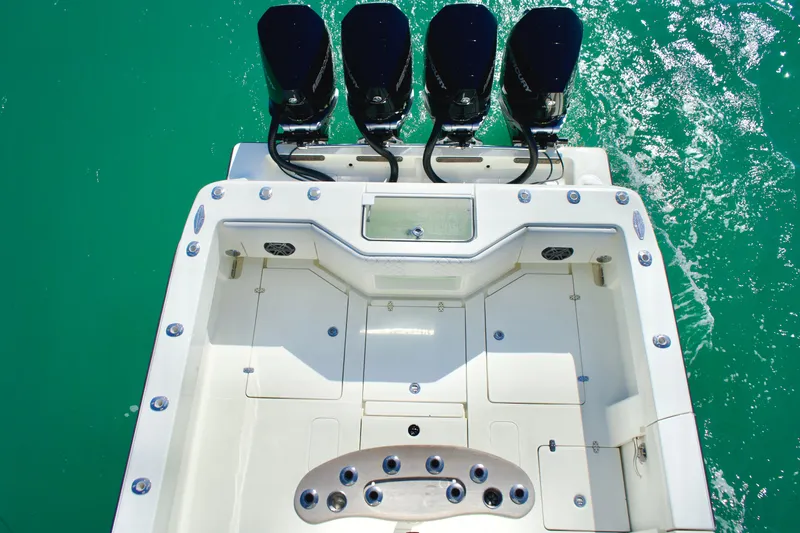  Yacht Photos Pics 2017 SeaVee 390Z boat with four powerful outboard engines on turquoise water.