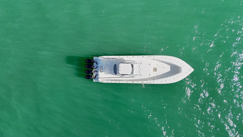  Yacht Photos Pics Aerial view of 2017 SeaVee 390Z boat on turquoise water.