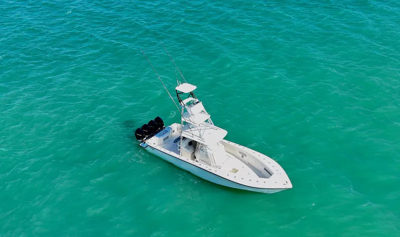  Yacht Photos Pics Aerial view of 2017 SeaVee 390Z boat on turquoise water.