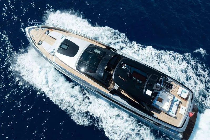 Clarity Yacht Photos Pics 2022 Riva 90' Argo yacht cruising on open blue sea, aerial view.
