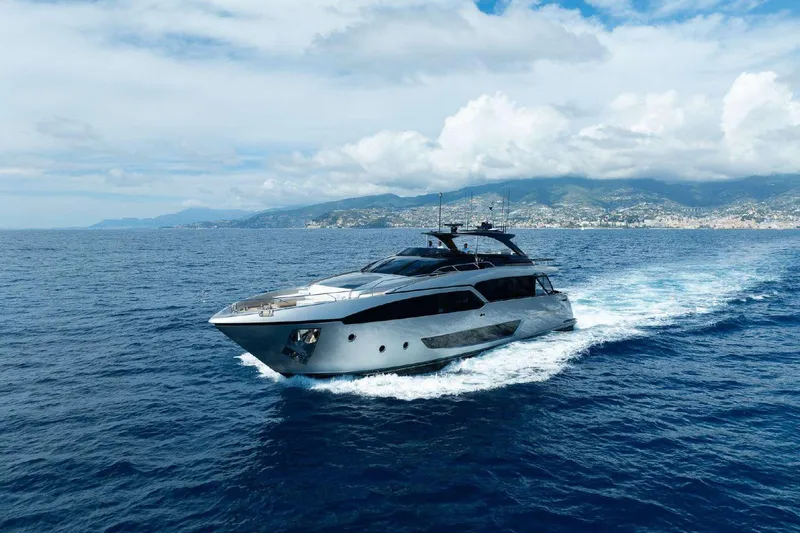 Clarity Yacht Photos Pics Luxury 2022 Riva 90' Argo yacht cruising on open sea with scenic coastline.