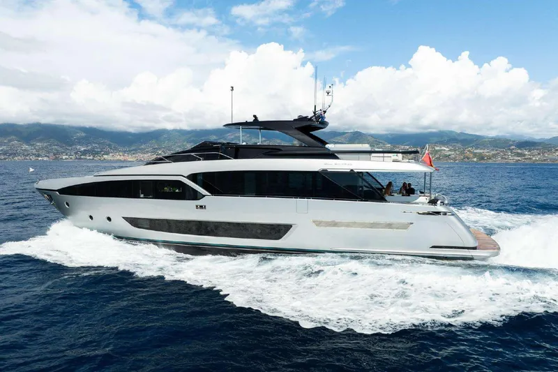 Clarity Yacht Photos Pics Luxury 2022 Riva 90' Argo yacht cruising on open sea with scenic coastline.