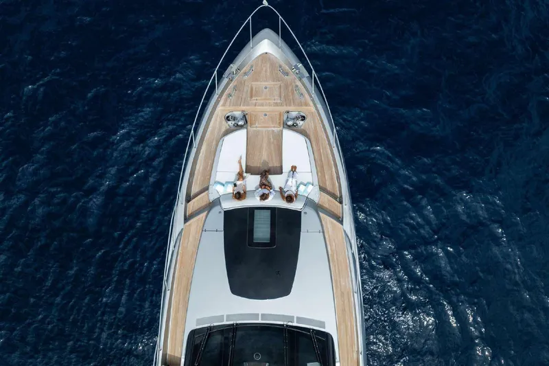 Clarity Yacht Photos Pics Aerial view of 2022 Riva 90' Argo yacht with people relaxing on deck.