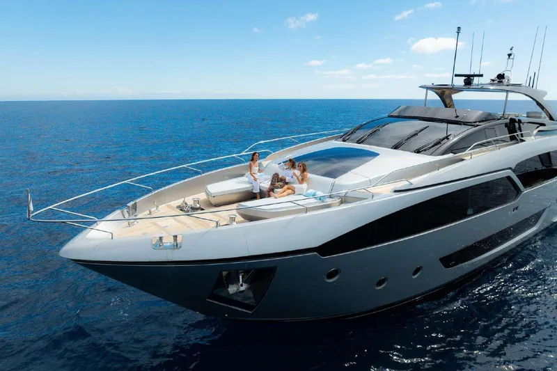 Clarity Yacht Photos Pics Luxurious 2022 Riva 90' Argo yacht cruising on open sea with passengers relaxing.