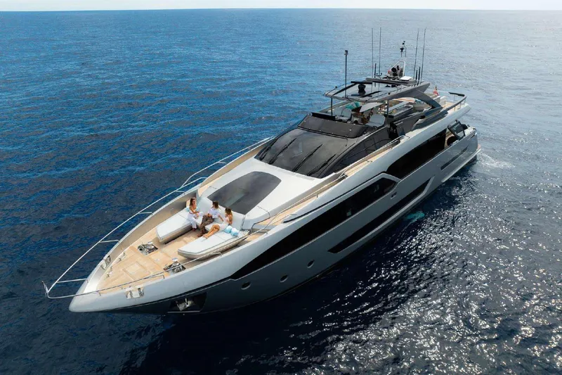 Clarity Yacht Photos Pics Luxury 2022 Riva 90' Argo yacht cruising on open sea with passengers relaxing.