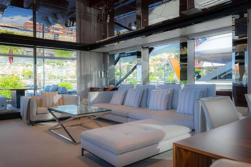 Clarity Yacht Photos Pics Luxurious interior of 2022 Riva 90' Argo yacht with modern furnishings and scenic views.