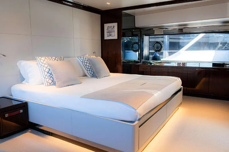 Clarity Yacht Photos Pics Luxurious bedroom interior of 2022 Riva 90' Argo yacht with modern design and elegant furnishings.