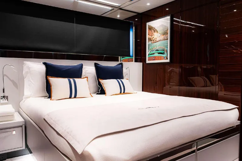 Clarity Yacht Photos Pics Luxurious bedroom interior on 2022 Riva 90' Argo yacht with elegant bedding and decor.