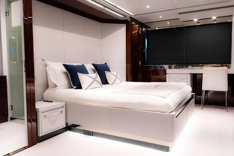 Clarity Yacht Photos Pics Luxurious bedroom interior on 2022 Riva 90' Argo yacht with modern design and elegant furnishings.
