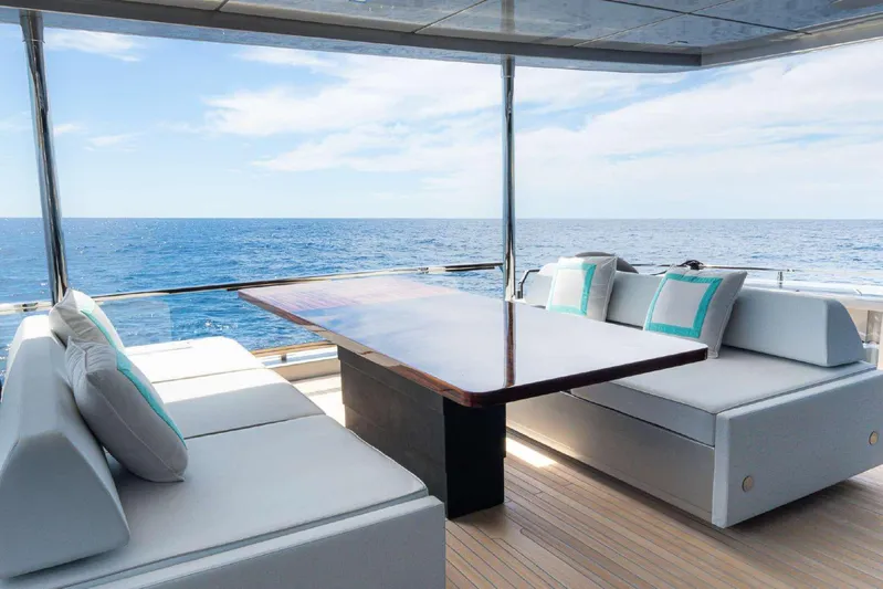Clarity Yacht Photos Pics Luxurious seating area on 2022 Riva 90' Argo yacht with ocean view.
