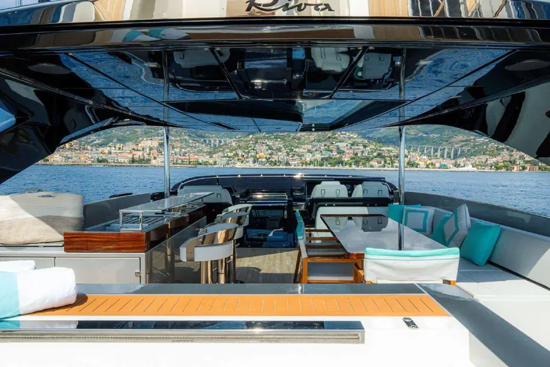 Clarity Yacht Photos Pics Luxurious 2022 Riva 90' Argo yacht interior with elegant seating and scenic ocean view.