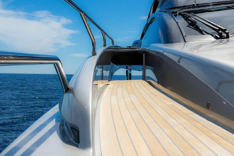 Clarity Yacht Photos Pics Luxury yacht Riva 90' Argo 2022, sleek deck view, cruising on open sea.