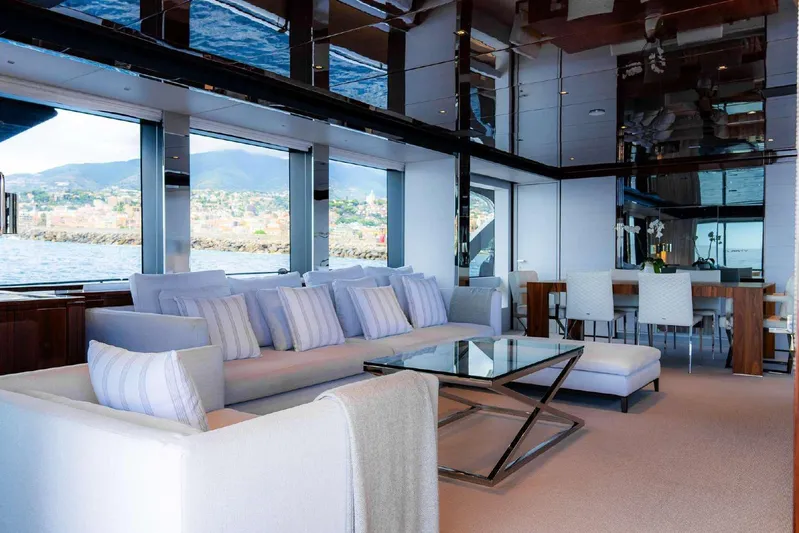 Clarity Yacht Photos Pics Luxurious interior of 2022 Riva 90' Argo yacht with elegant seating and ocean view.