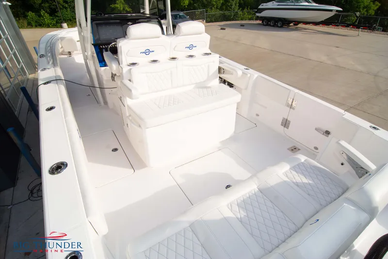  Yacht Photos Pics 2023 Fountain 34 CC boat interior with white seating and modern design.