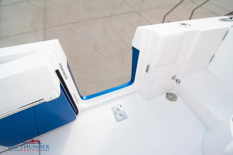  Yacht Photos Pics 2023 Fountain 34 CC boat interior with white and blue design, featuring a sleek entryway.