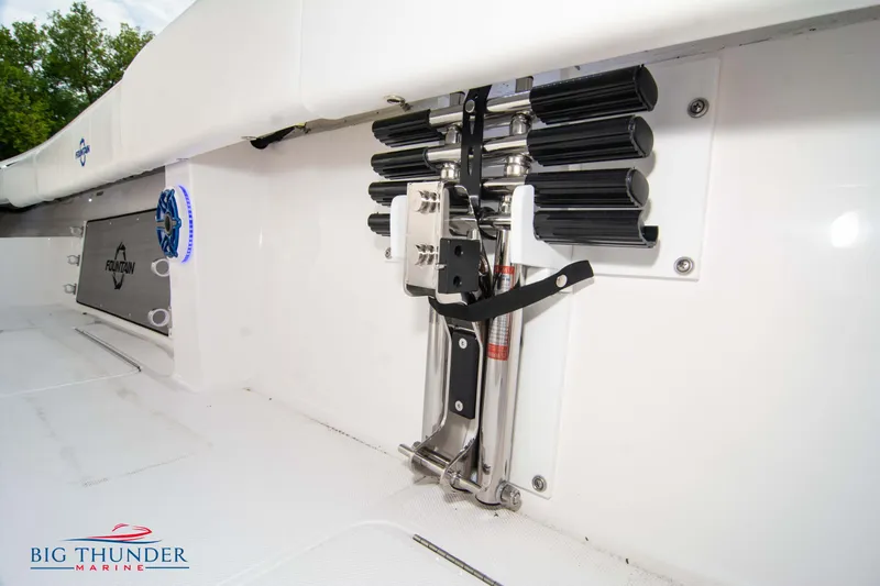  Yacht Photos Pics 2023 Fountain 34 CC boat interior with rod holders and branded logo.