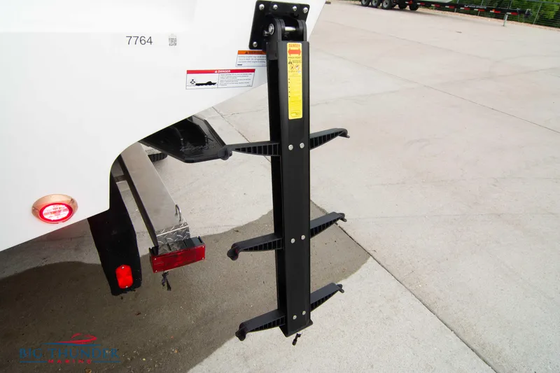  Yacht Photos Pics 2023 Fountain 34 CC boat ladder and rear light detail on concrete surface.