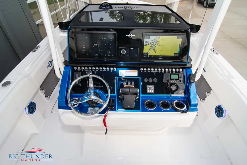  Yacht Photos Pics 2023 Fountain 34 CC boat dashboard with advanced navigation and control systems.