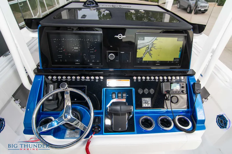  Yacht Photos Pics 2023 Fountain 34 CC boat dashboard with navigation screens and controls.