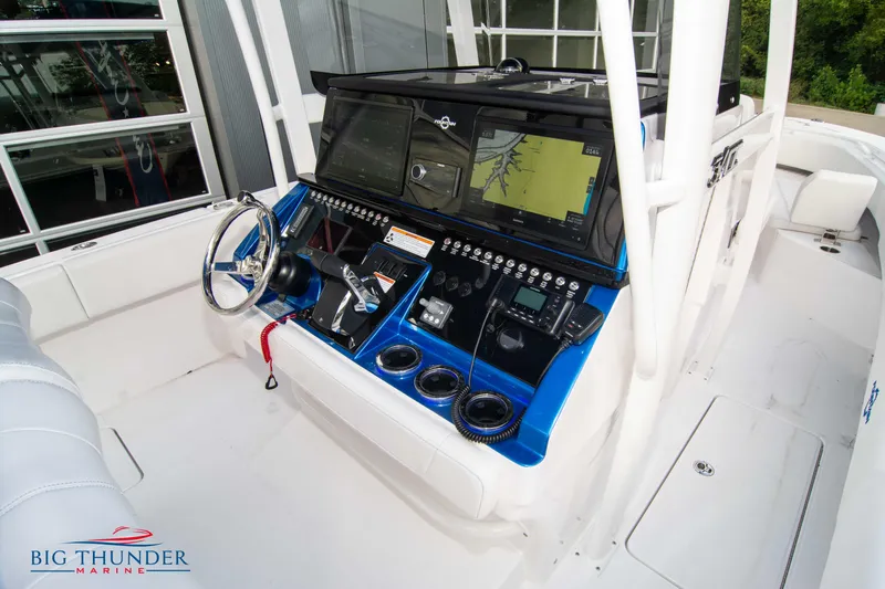  Yacht Photos Pics 2023 Fountain 34 CC boat cockpit with advanced navigation system and controls.