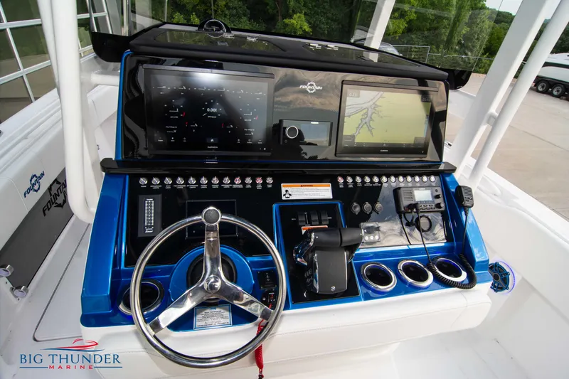  Yacht Photos Pics 2023 Fountain 34 CC boat dashboard with advanced navigation and control systems.
