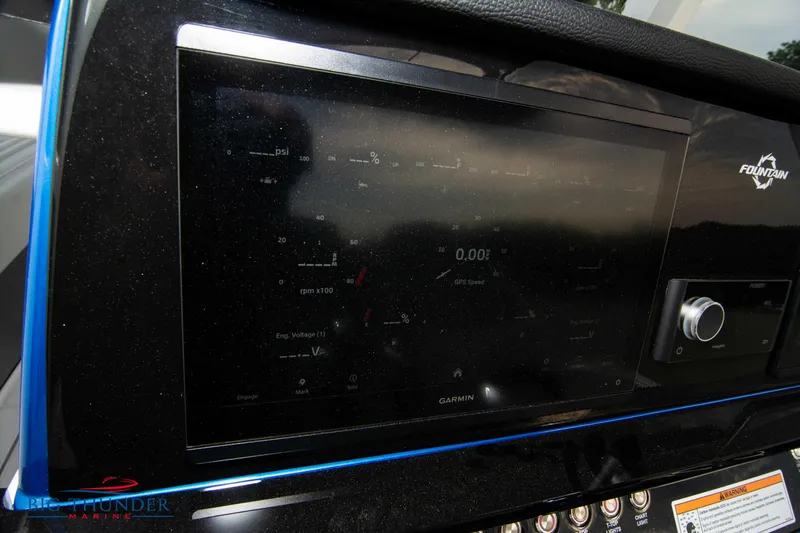 Yacht Photos Pics 2023 Fountain 34 CC boat dashboard with Garmin display and controls.