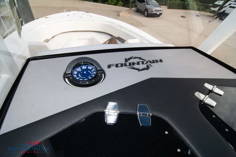  Yacht Photos Pics 2023 Fountain 34 CC boat dashboard with compass and logo, at Big Thunder Marine.